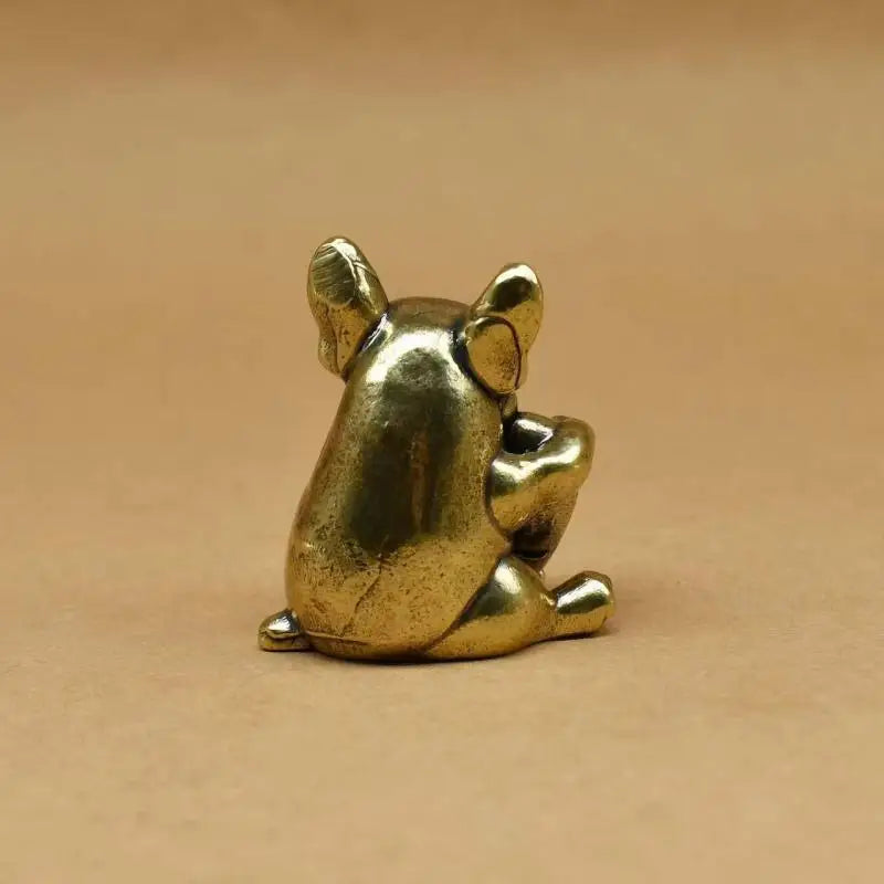 Small antique brass puppy figurine, perfect as a cute desk ornament or collectible tea pet for dog lovers.