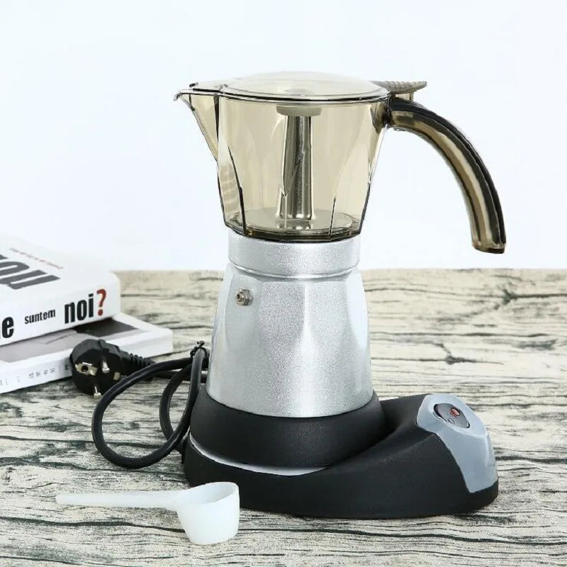 Electric Moka pot coffee maker with silver aluminum base, transparent brown top, and black electric heating stand.
