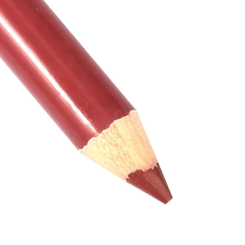 Sharpened deep red velvet matte lip liner pencil for precise lip makeup application on a white background.