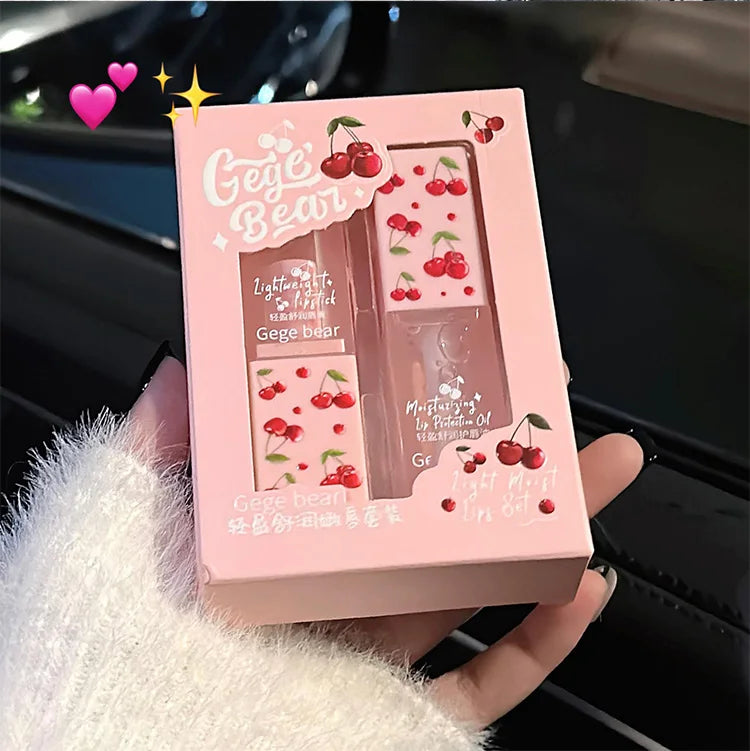 Gege Bear cherry lip balm and lip oil set in pink box. Moisturizing makeup with cute cherry print for tender lips.