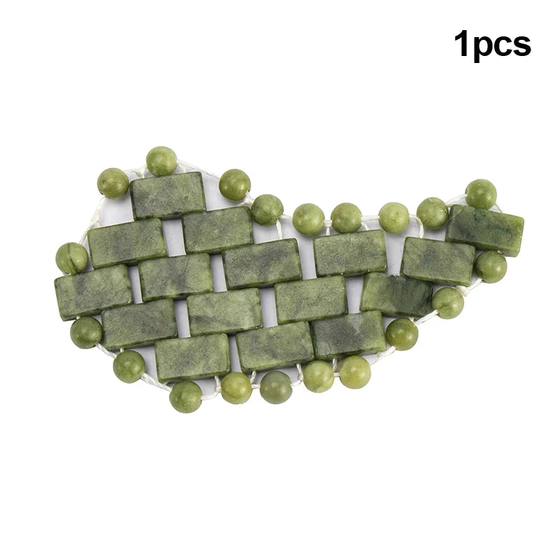 Natural green jade stone eye mask for cooling massage and relaxation, featuring rectangular tiles and beaded edges.