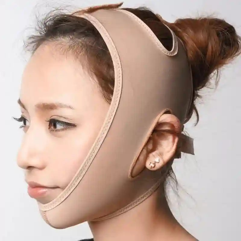 Woman wearing a beige elastic face-slimming bandage that wraps under the chin and over the head with ear cutouts.