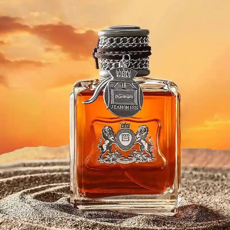 JEAN MISS Woody Eau De Toilette for men. 100ml luxury square glass bottle with lion crest in desert sunset setting.