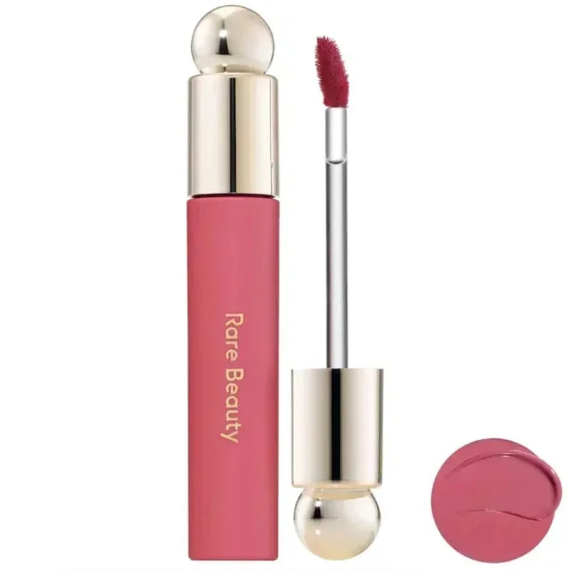 Rare Beauty Soft Pinch Tinted Lip Oil with doe-foot applicator, showing glossy rose pink pigment and matte tube.