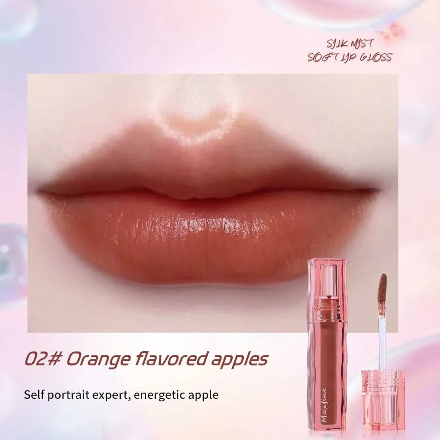 Moisturizing orange-toned liquid lipstick with a glossy, pigmented finish and applicator, perfect for long-wear lip makeup.