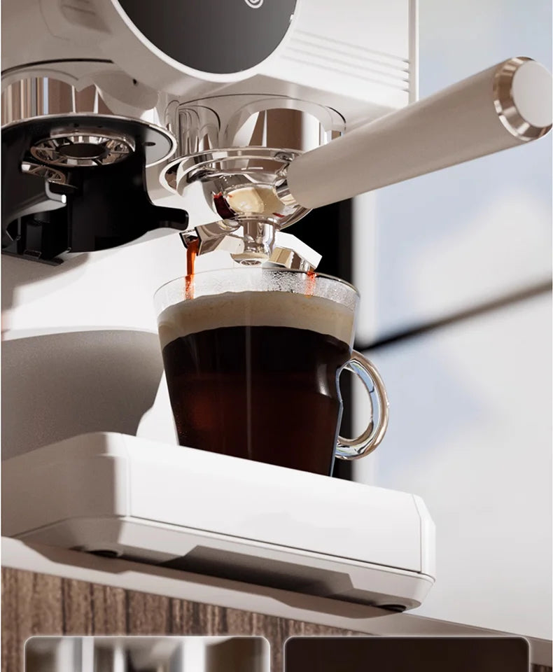 White espresso machine with chrome portafilter dispensing coffee into a clear glass cup on a modern drip tray.