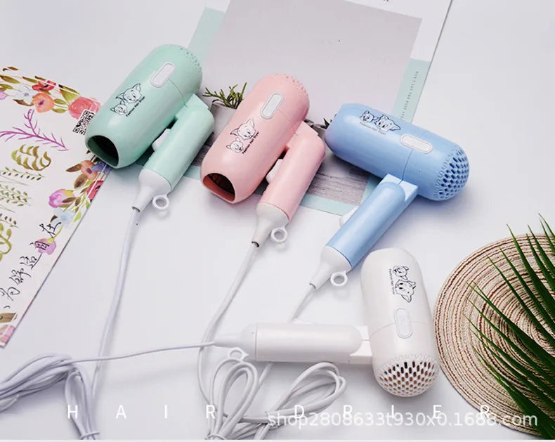 Colorful foldable mini hair dryers with high-power ionic drying in pastel mint, pink, blue, and white.