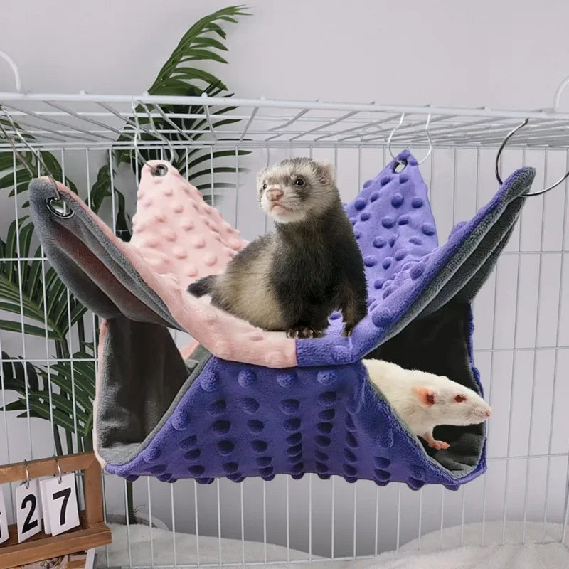 Cozy purple and pink plush pet hammock for ferrets and rats. Double-layer winter cage bed for warmth and comfort.