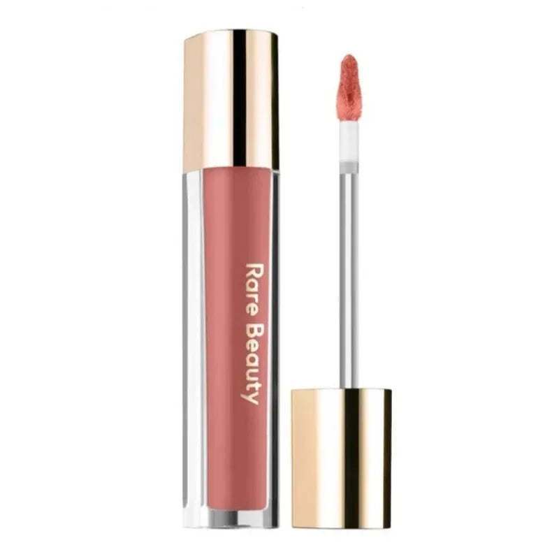 Rare Beauty Soft Pinch Tinted Lip Oil with doe-foot applicator in a hydrating, glossy muted rose shade.