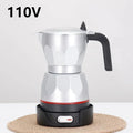 Silver electric moka pot coffee maker on a black 110V heating base with black handle and power switch.
