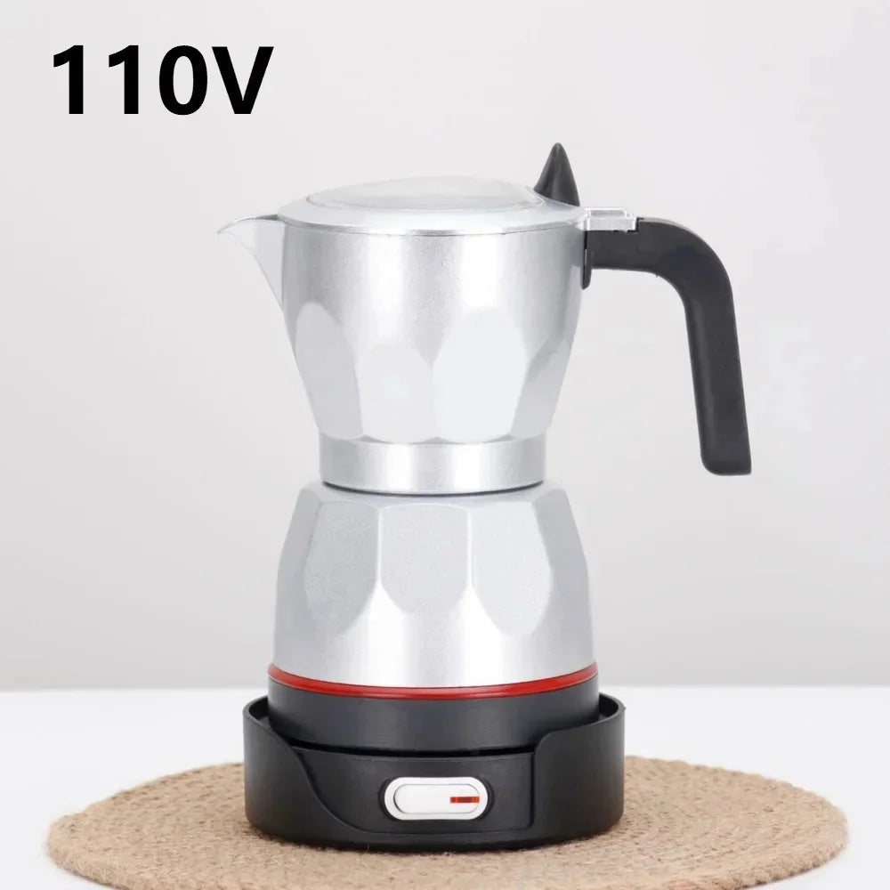 Silver electric moka pot coffee maker on a black 110V heating base with black handle and power switch.