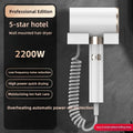 White 2200W wall-mounted hair dryer with coiled cord, silent motor, and ion care for hotel-style bathroom drying.
