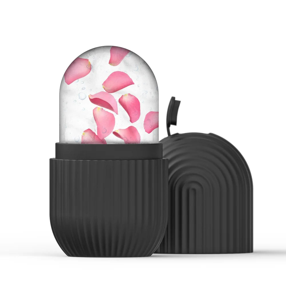Black silicone ice roller mold with a dome of frozen water containing pink rose petals, next to its matching lid.