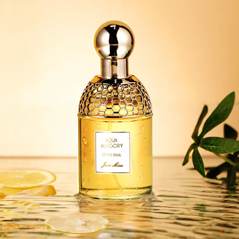 Jean Miss Aqua Allegory Citrus Basil EDT, 100ml. Long-lasting floral perfume in honeycomb glass bottle with gold cap.