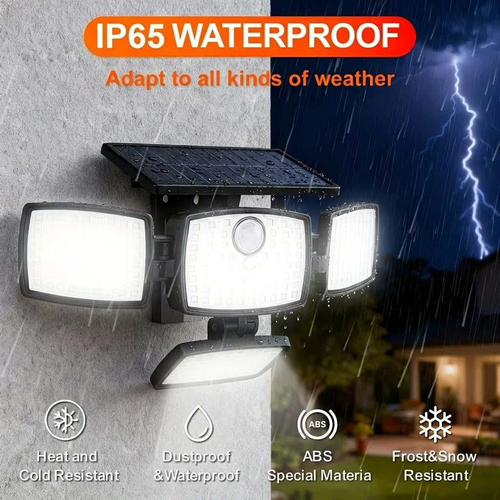 Black 4-head outdoor solar flood light mounted on a wall, illuminating brightly during a stormy night.