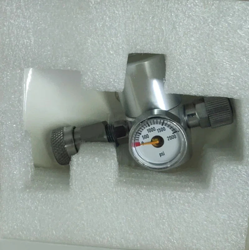 Silver metal coffee equipment pressure gauge with PSI dial for precise espresso brewing, securely packed in foam.