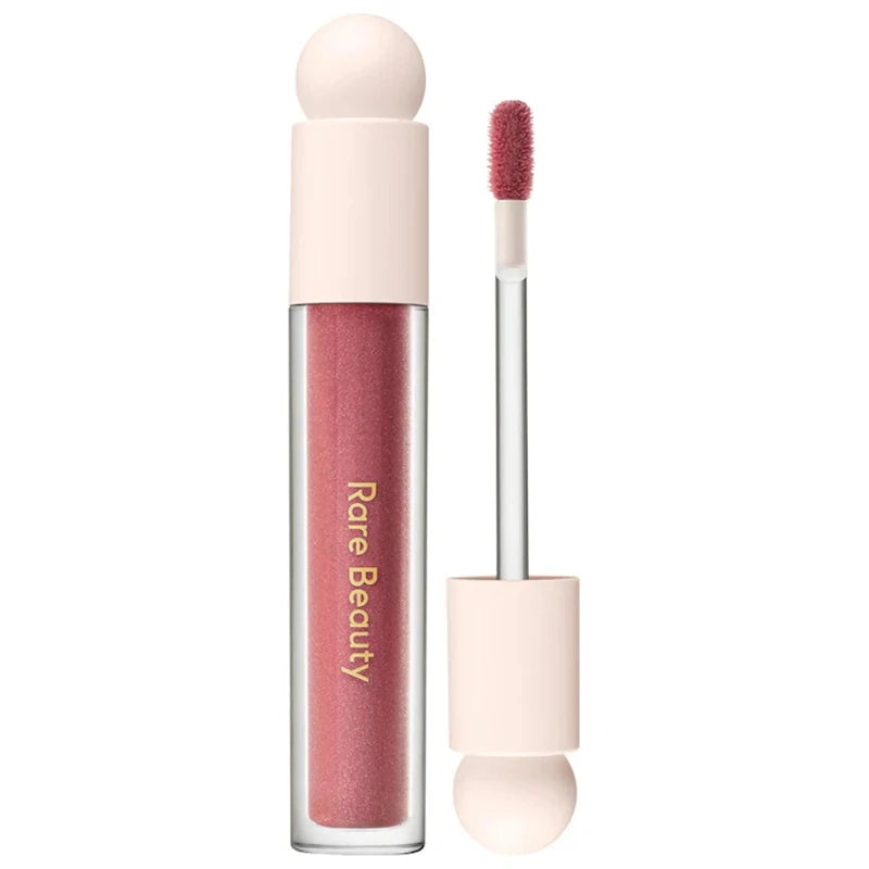 Rare Beauty Soft Pinch Tinted Lip Oil with doe-foot applicator in a hydrating, glossy mauve-pink formula.