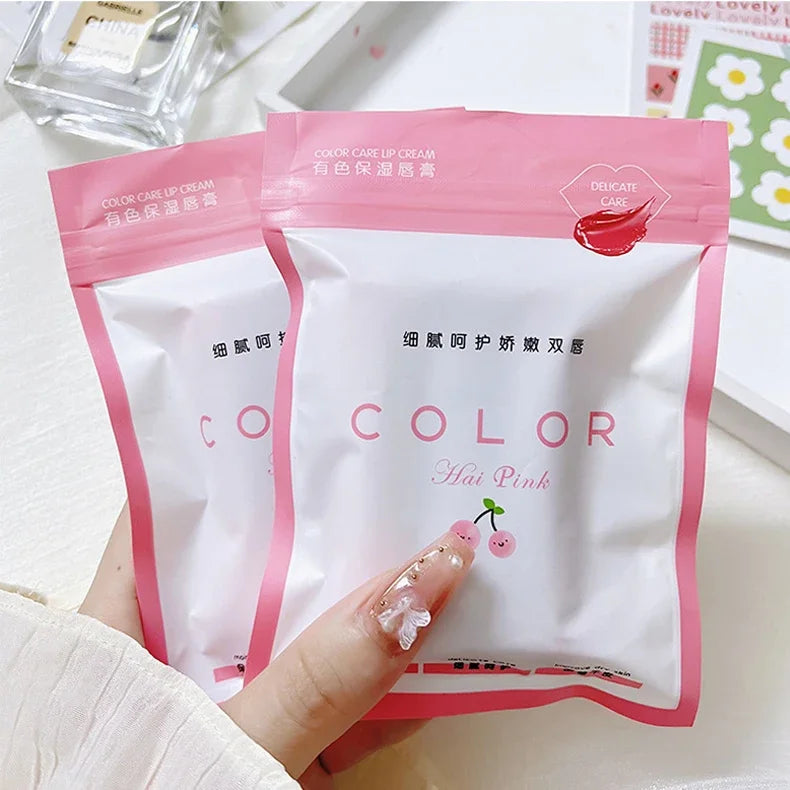 Cute moisturizing lip balm pouches in pink packaging, featuring red tint lip care for hydrated, anti-dry lips.