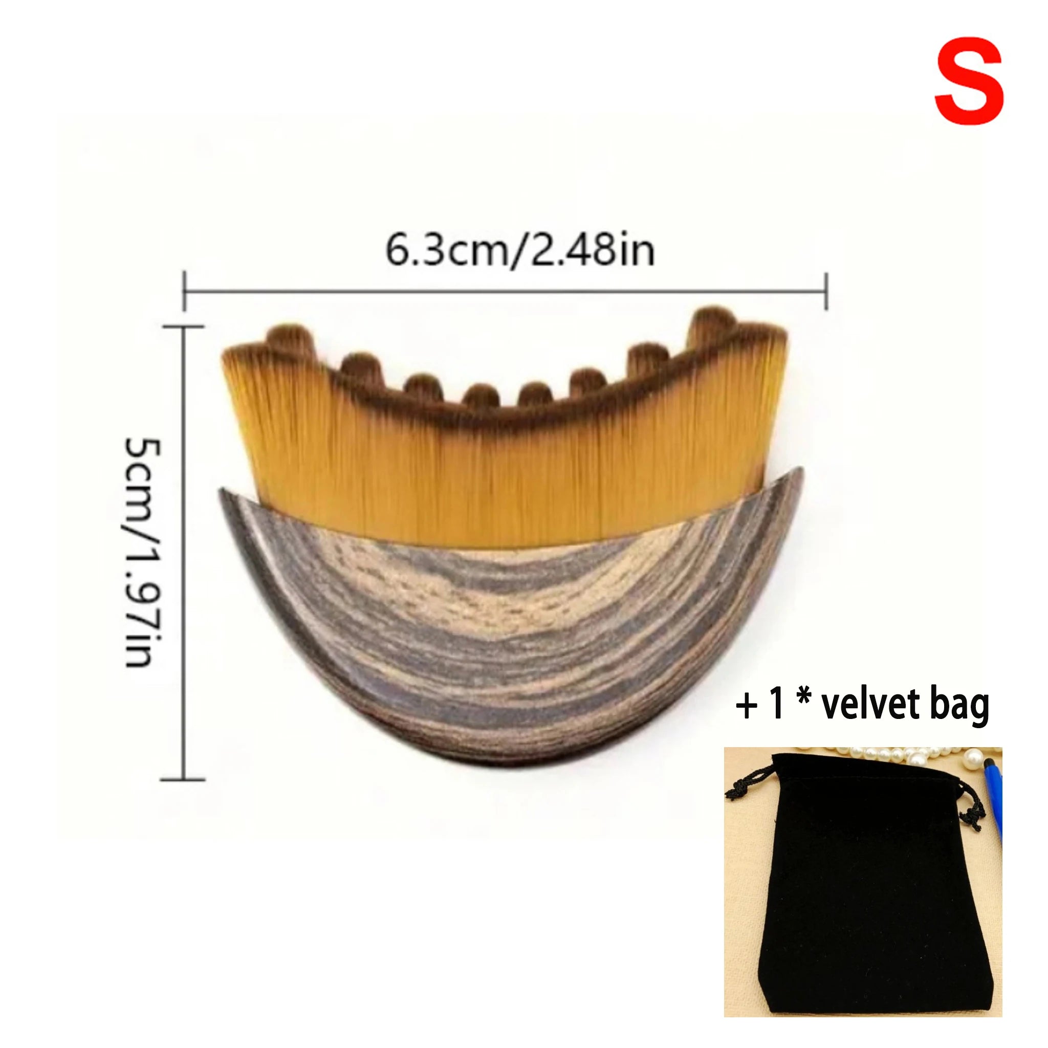 Crescent-shaped facial massage brush with brown ombre bristles, wood-grain handle, and an included black velvet bag.