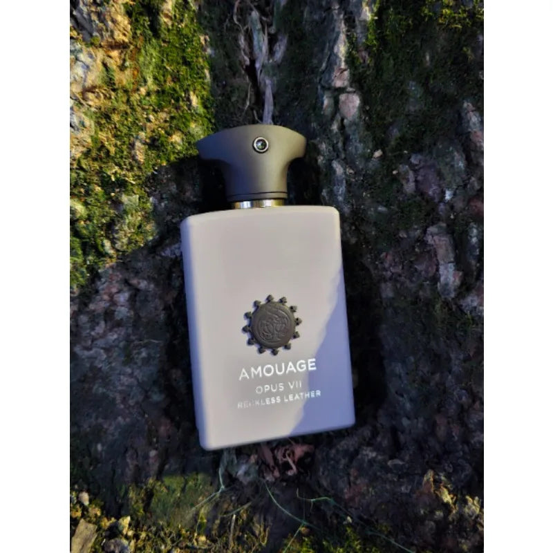Amouage Opus VII Reckless Leather EDP: rectangular grey bottle, luxury woody aromatic men's fragrance on tree bark.