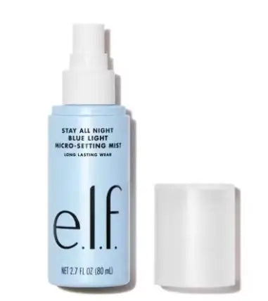 e.l.f. Stay All Night Blue Light Micro-Setting Mist in a light blue spray bottle with a white cap.