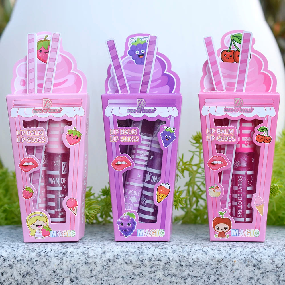 Cute ice cream-themed lip gloss and balm set in pink and purple fruit-inspired packaging. Moisturizing, shiny finish.