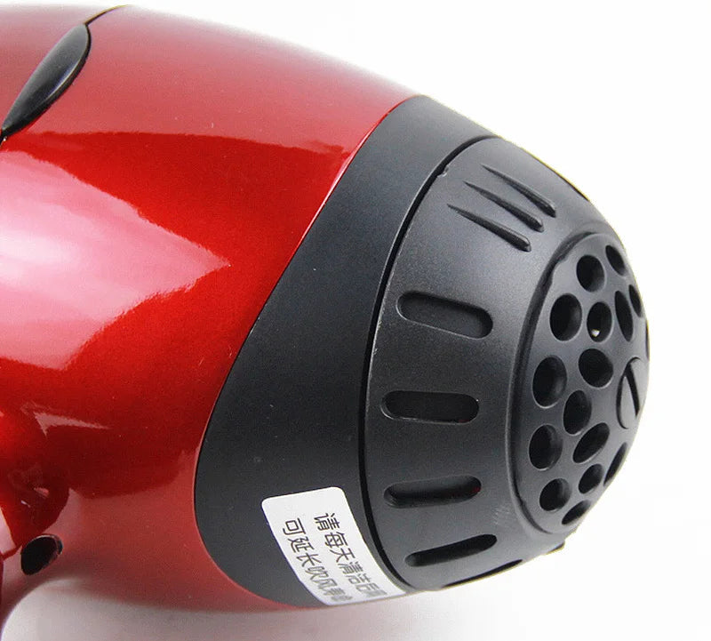 Glossy red professional 2300W salon hair dryer with a durable black rear air intake grill and 3-meter long cord.