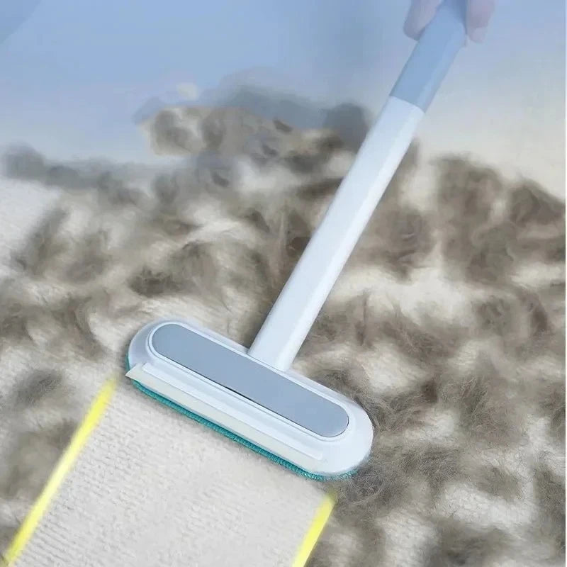 Blue and white manual pet hair remover tool cleaning dog and cat fur from carpet and furniture surfaces.