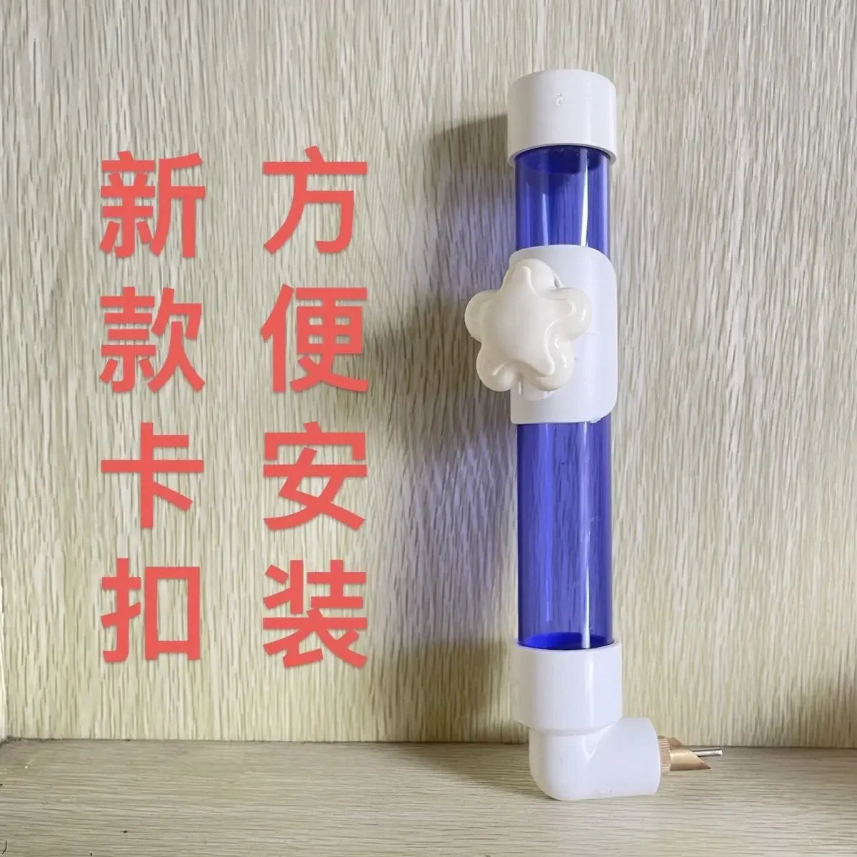 Large blue automatic parrot water dispenser with needle feeder for easy, mess-free hydration in bird cages.