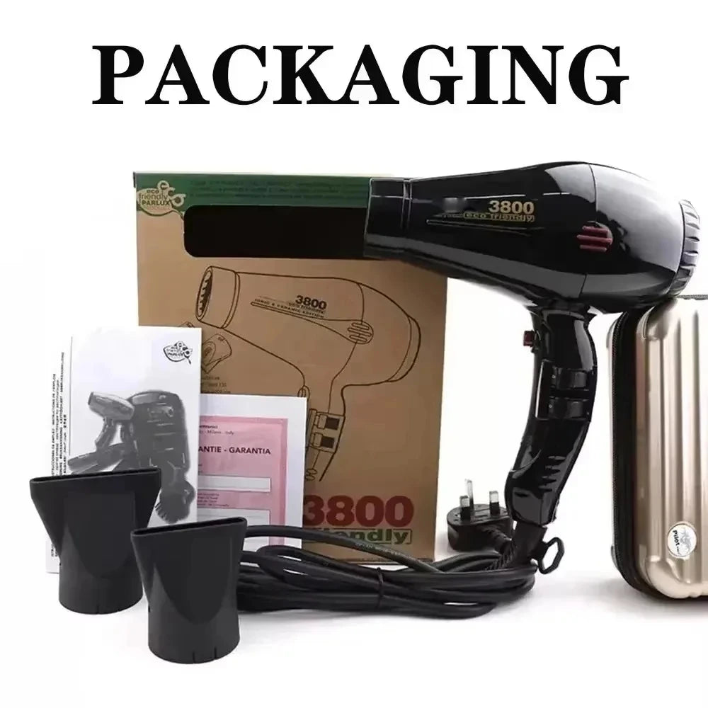 Black 2100W hair dryer with 2 nozzle attachments, retail box, and manual for professional ionic styling at home.