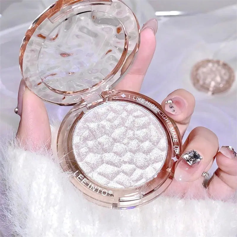 Tidesmit LEE INTO highlighter powder texture close-up featuring fine shimmer and pearlescent face makeup finish