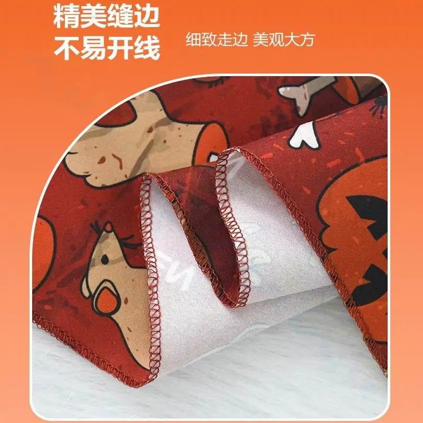 Red Halloween dog bandana with pumpkin and bat print, durable stitched edges for festive pet costume parties.