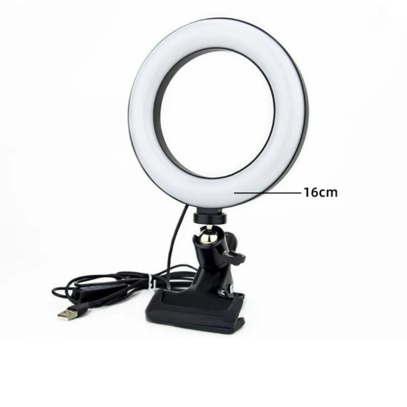 16cm circular LED ring light with a black clamp base and USB power cable for desktop video calls and content creation.
