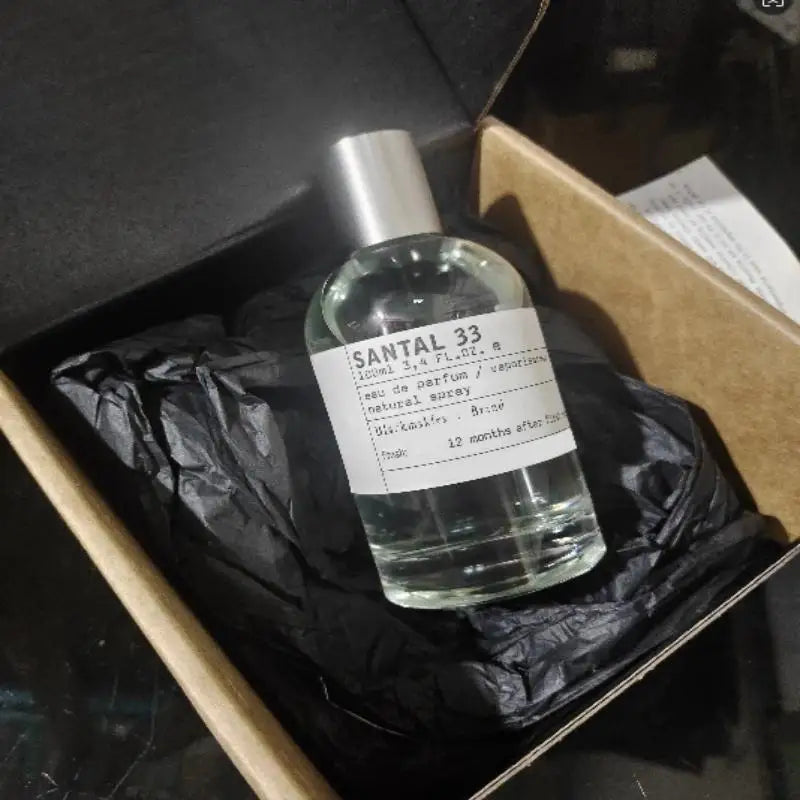 Le Labo Santal 33 EDP 3.4oz perfume spray. Unisex woody fragrance in minimalist glass bottle. Luxury holiday gift.