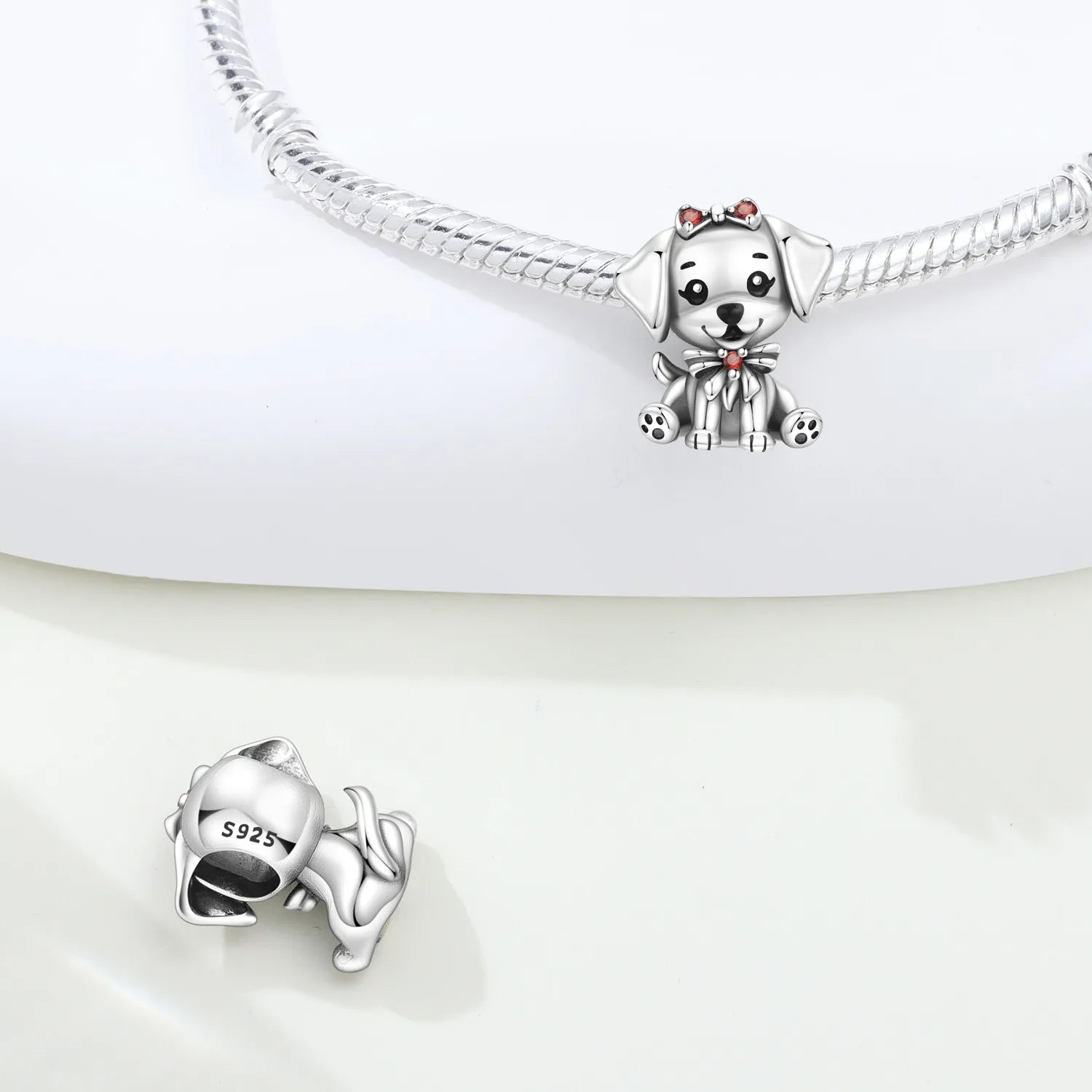 925 Sterling Silver puppy dog charm bead with bow for personalized DIY charm bracelets and pet lover jewelry gifts.