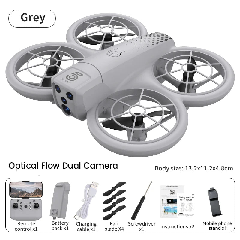 Grey quadcopter drone with four propeller guards and dual cameras, includes remote, battery, and accessories.
