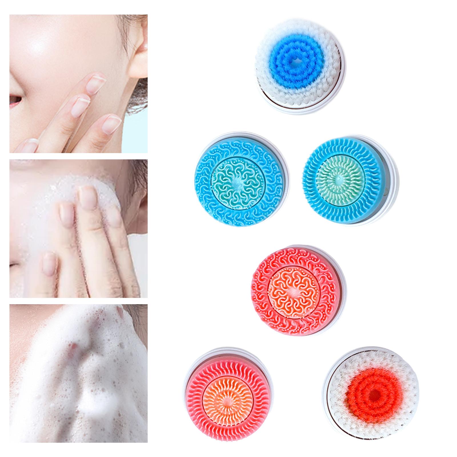 Three round facial cleansing brush heads with silicone and soft bristle textures in blue, pink, and orange.