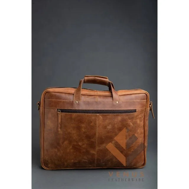 Tan genuine leather designer business briefcase with top handles, zippered front pocket, and crossbody strap rings.