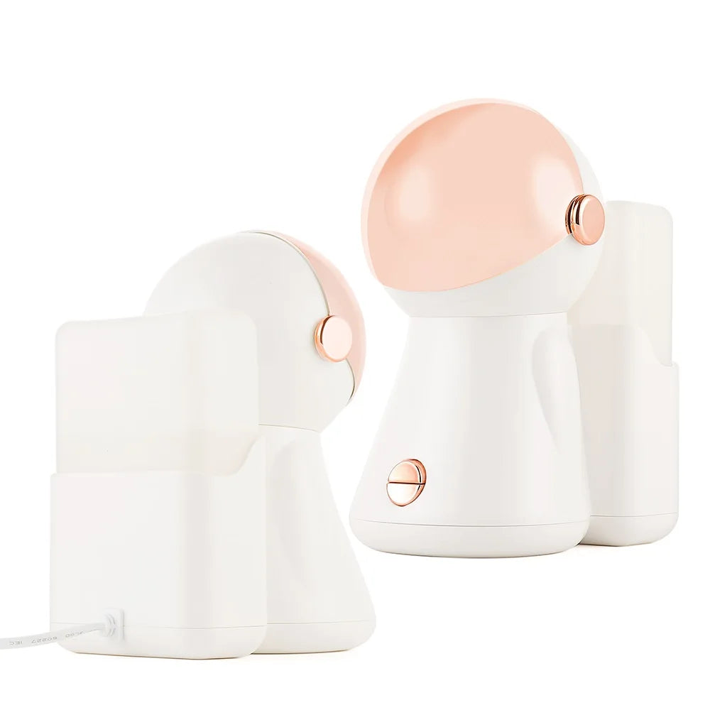 Astronaut-shaped white and rose gold humidifier with a USB power cord and a matching detachable water reservoir.