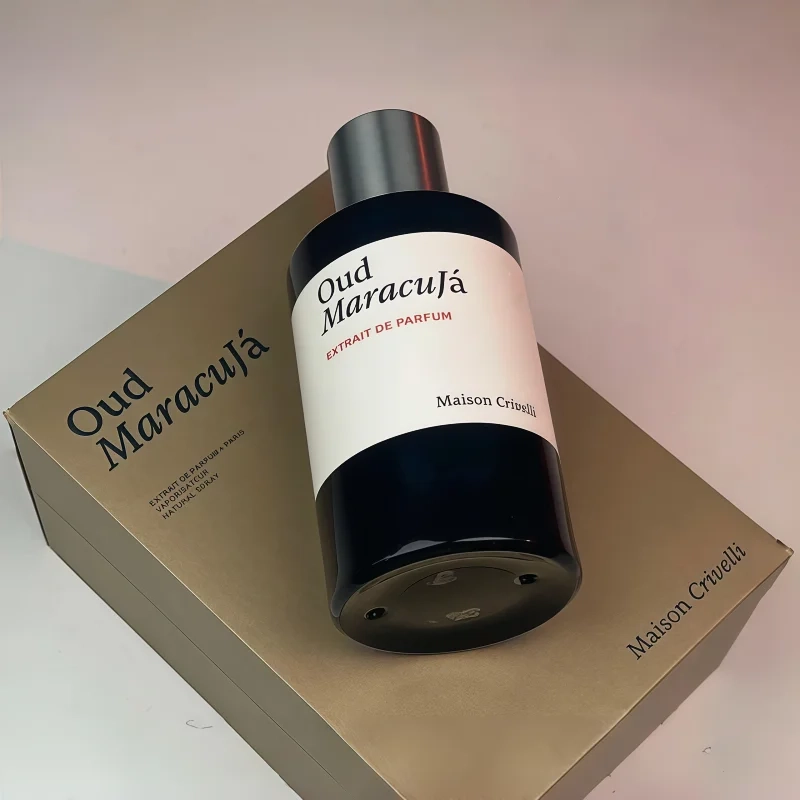 Maison Crivelli Oud Maracuja Extrait de Parfum: unisex luxury oud & passionfruit scent in a sleek cylindrical bottle.