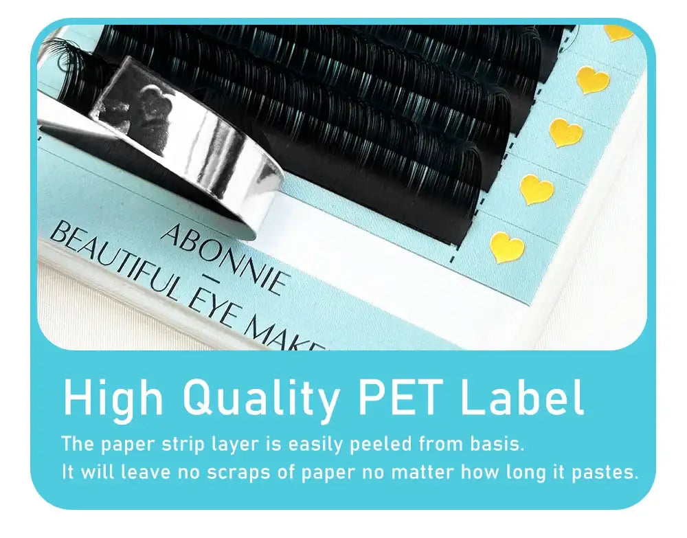 Abonnie ultra matte black individual eyelash extensions on a light blue tray with yellow heart sticker markers.