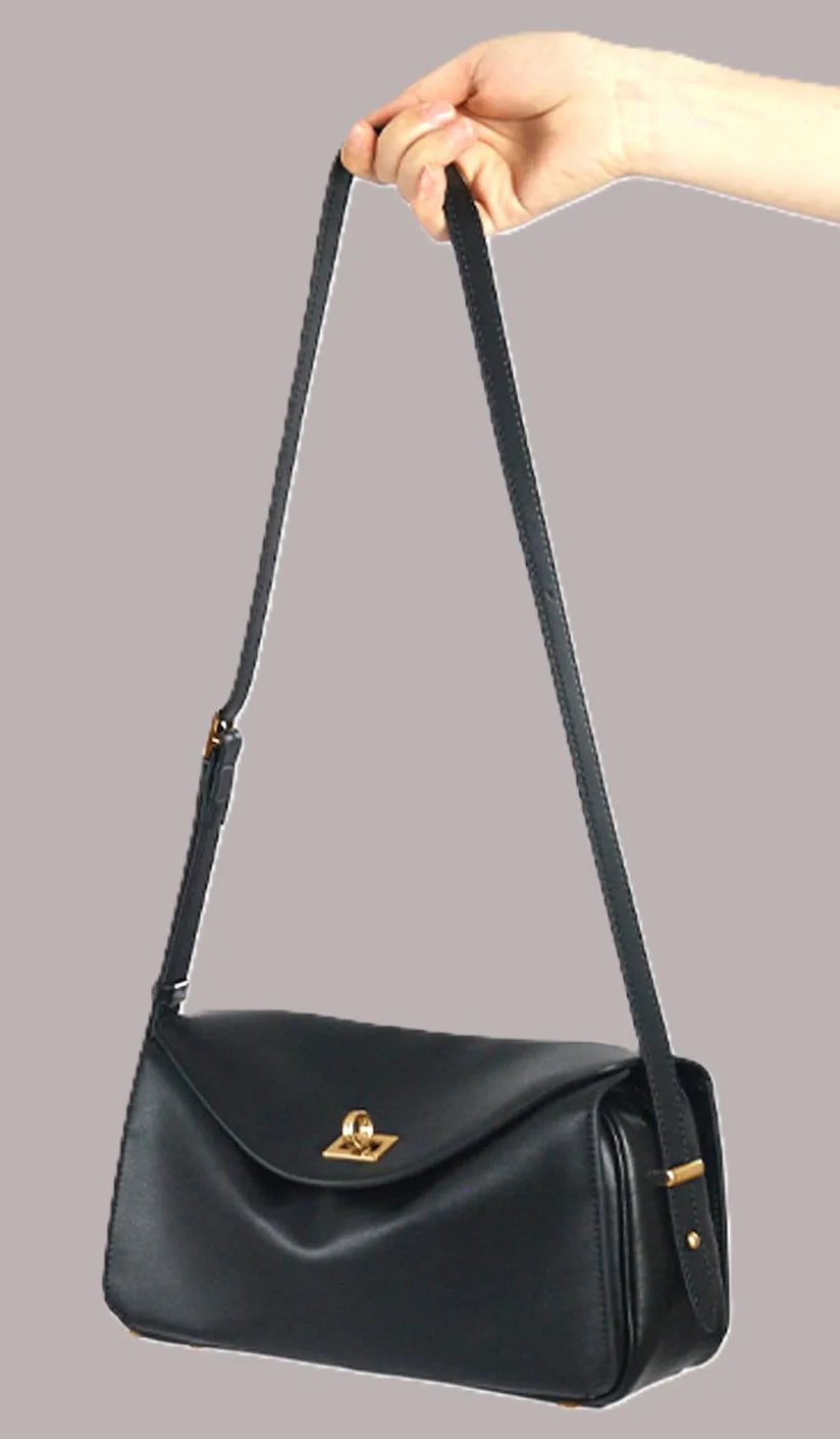 Royaa black waterproof genuine leather luxury shoulder bag with classic small silhouette and elegant gold-tone hardware.