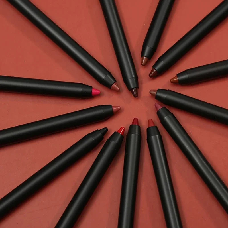 Matte, waterproof lip liner pencils in assorted nude, brown, and red shades arranged in a circle on a red background.