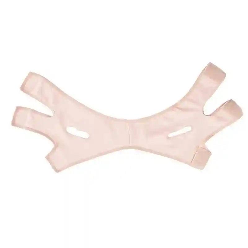 Pink, elastic V-line face slimming bandage with ear cutouts and adjustable velcro straps.