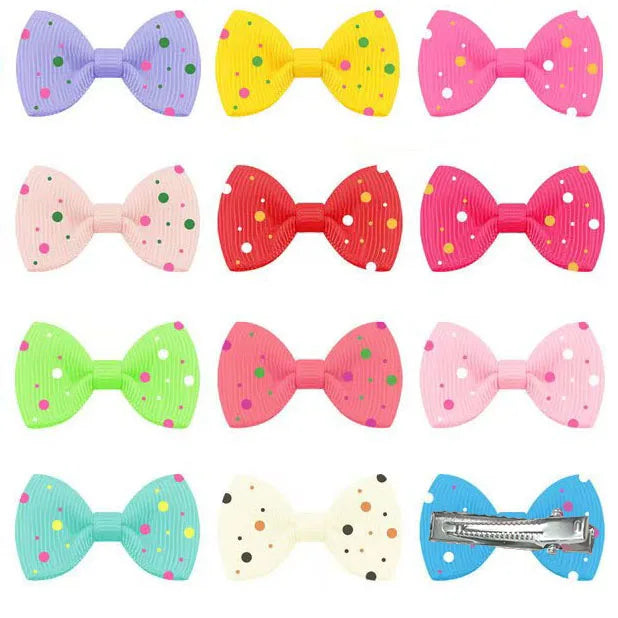 Colorful polka dot hair bows for dogs and cats. Durable ribbon grooming clips for small pet styling and accessories.