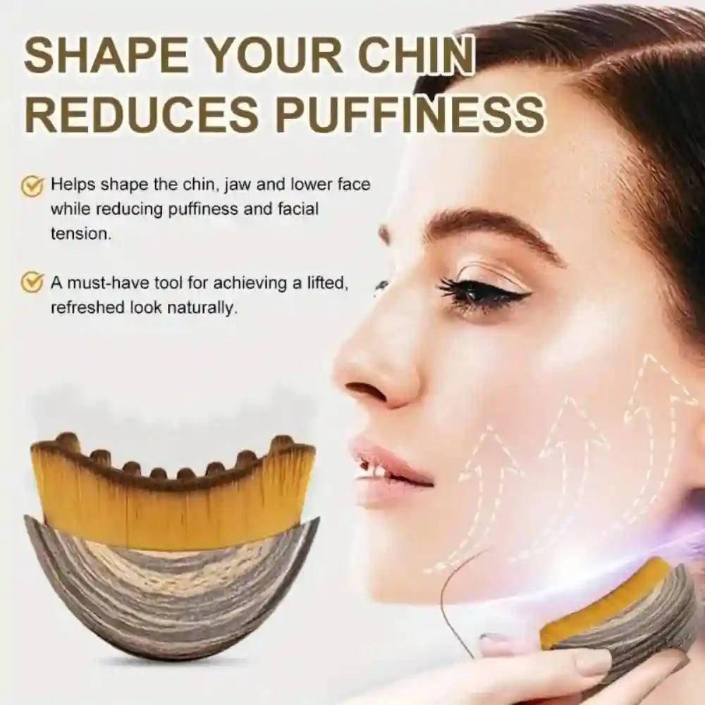 A wooden-finish, crescent-shaped face contouring brush with soft bristles, shown in use on a woman’s jawline.