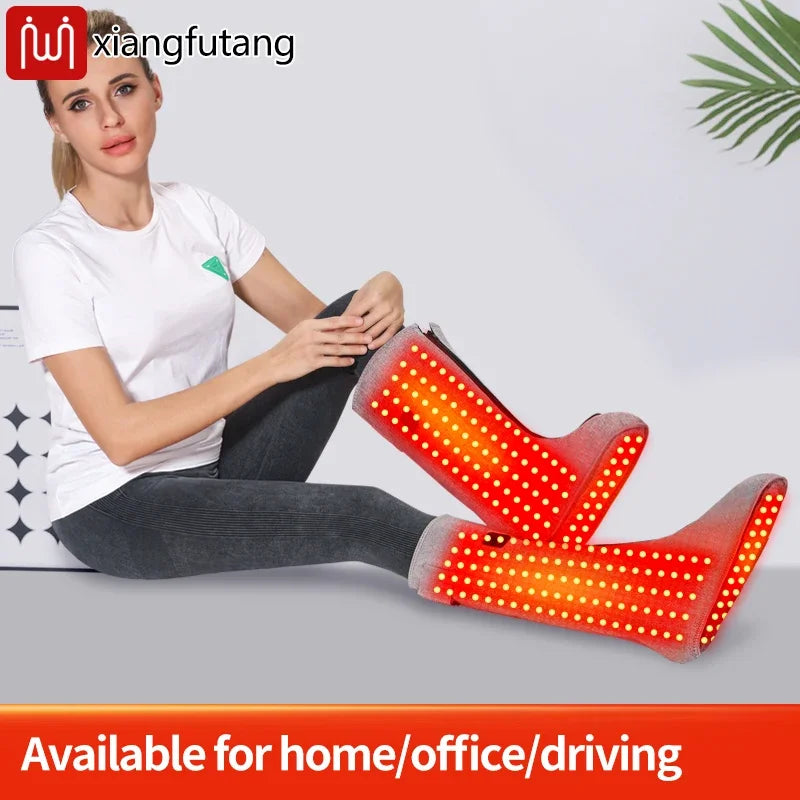 Heated leg and foot massager wrap with red light therapy for pain relief and warmth in a grey fabric boot design.