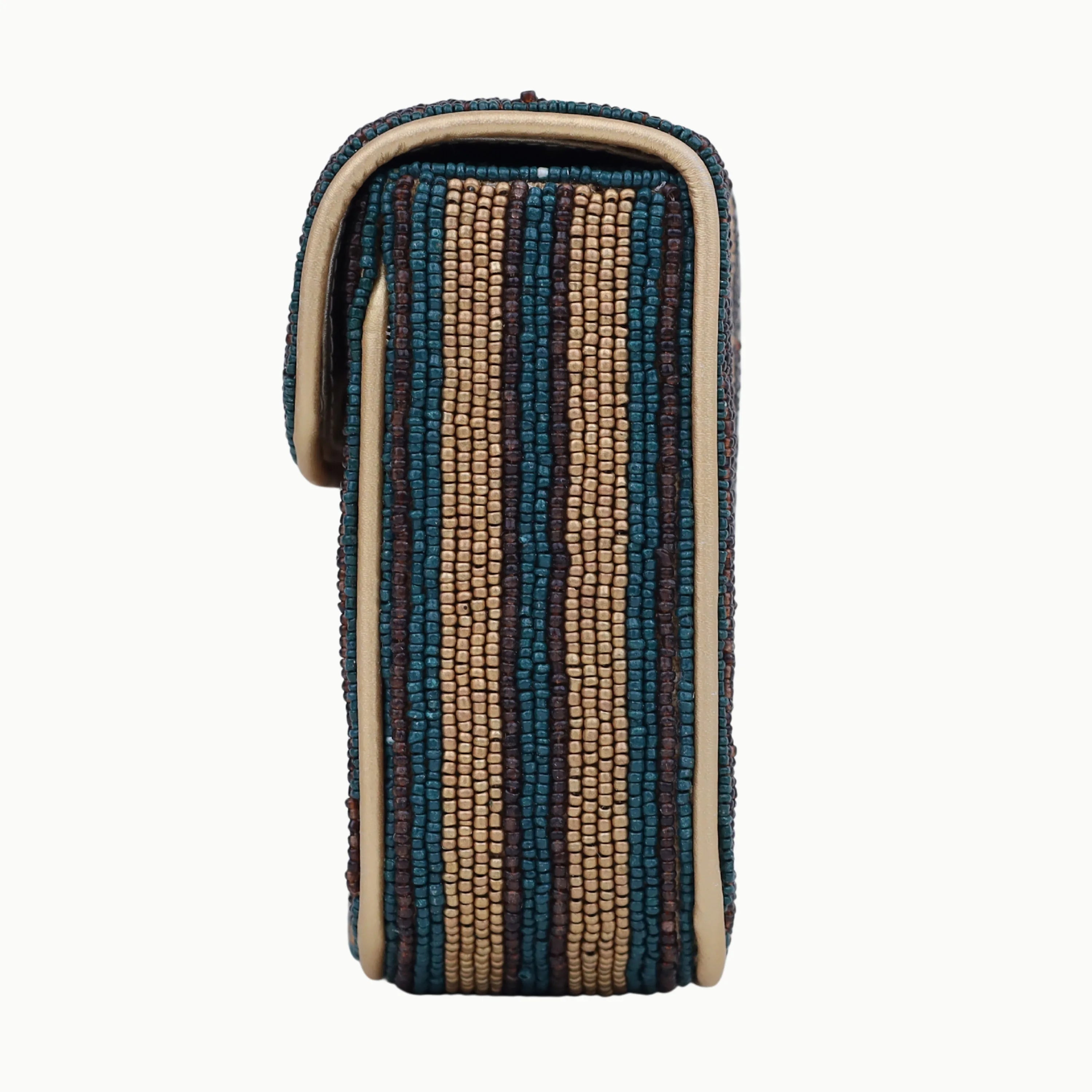 Bohemian designer shoulder bag, multi-color striped beaded flap, cream leather trim, vertical rectangular silhouette.