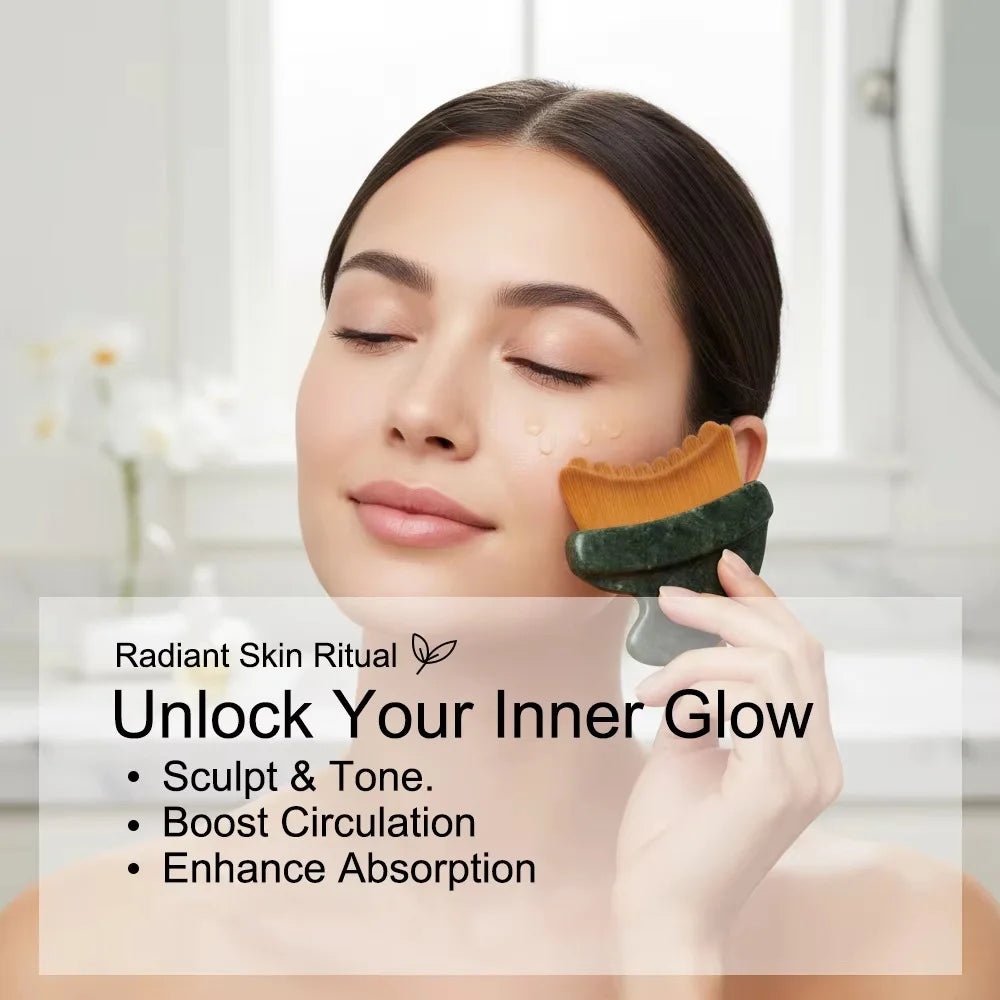 A woman using a dark green stone-handled gua sha facial brush with soft, curved, tan-colored bristles on her cheek.