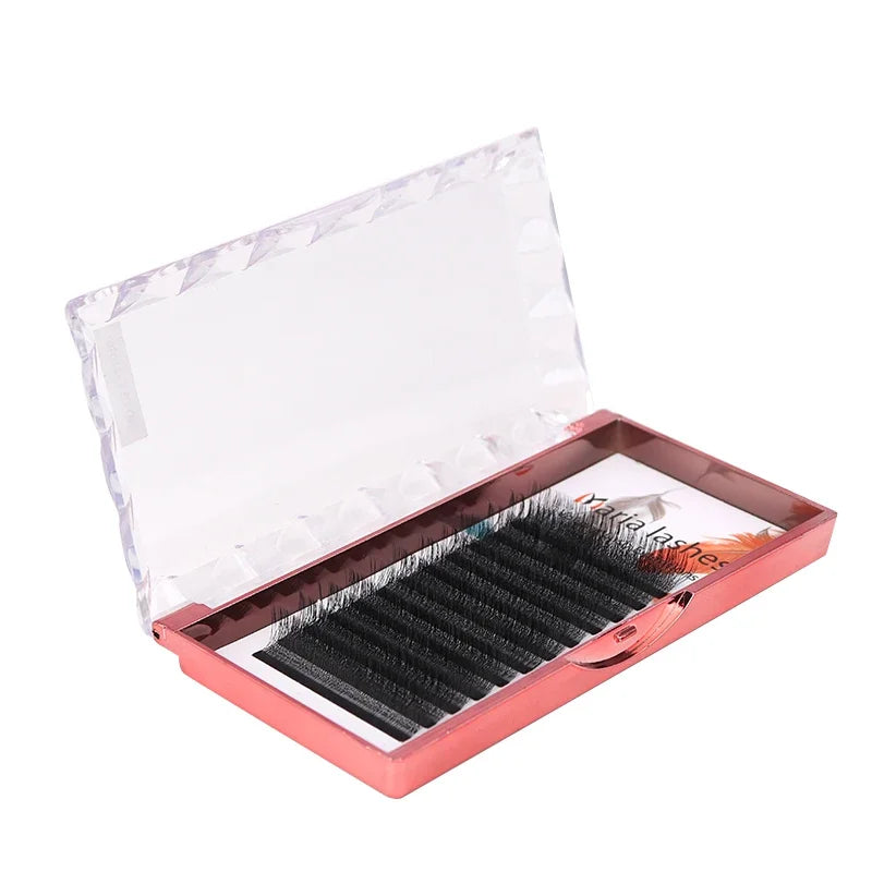 12 rows of black 5D W-style volume eyelash extensions in a metallic rose gold open tray.